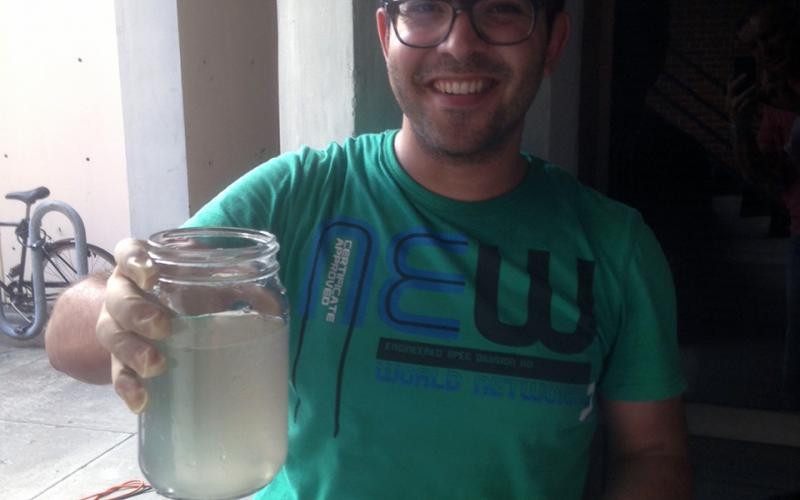 Sherif Elsayed is showing the effluent of dog poop slurry (a surrogate for human fecal sludge) treated in our supercritical water oxidation prototype (June 2016)